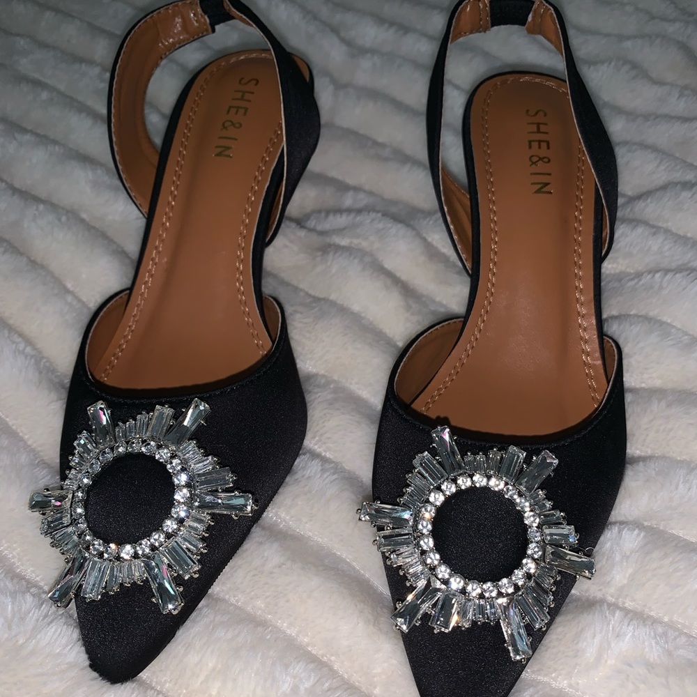 Black open back pointy heels with silver gem in the middle